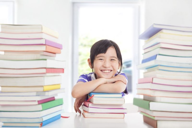 Enjoy studying School. Kid student holding books.